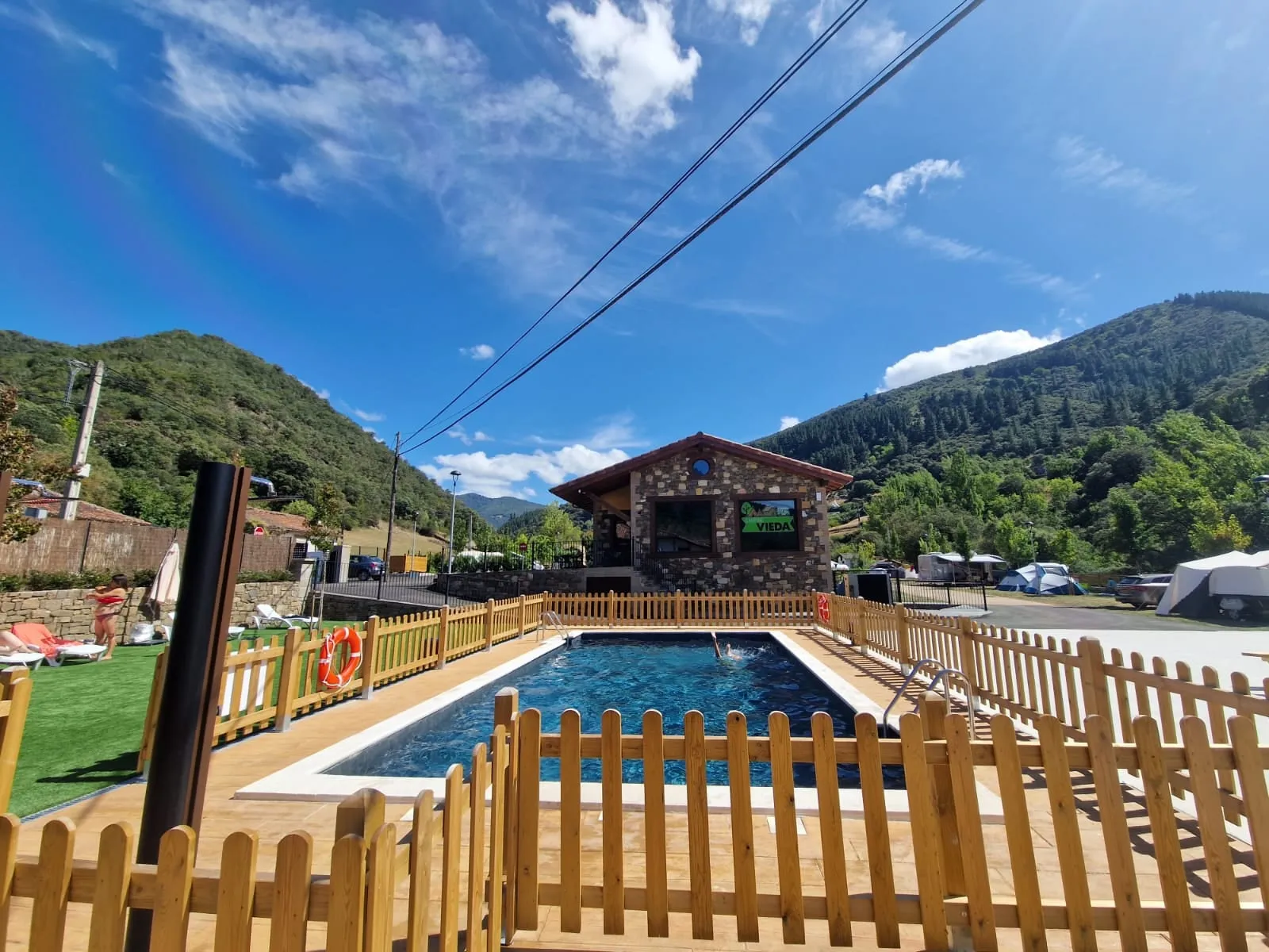 Pool and green areas at Camping Vieda